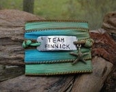 The Hunger Games Bracelet Wrap - TEAM FINNICK Hand Stamped  with Sea & Sand Green/ Blue Silk Ribbon Wrap