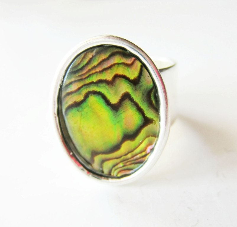 Chartreuse yellow paua shell and silver ring.  Gold abalone shell.