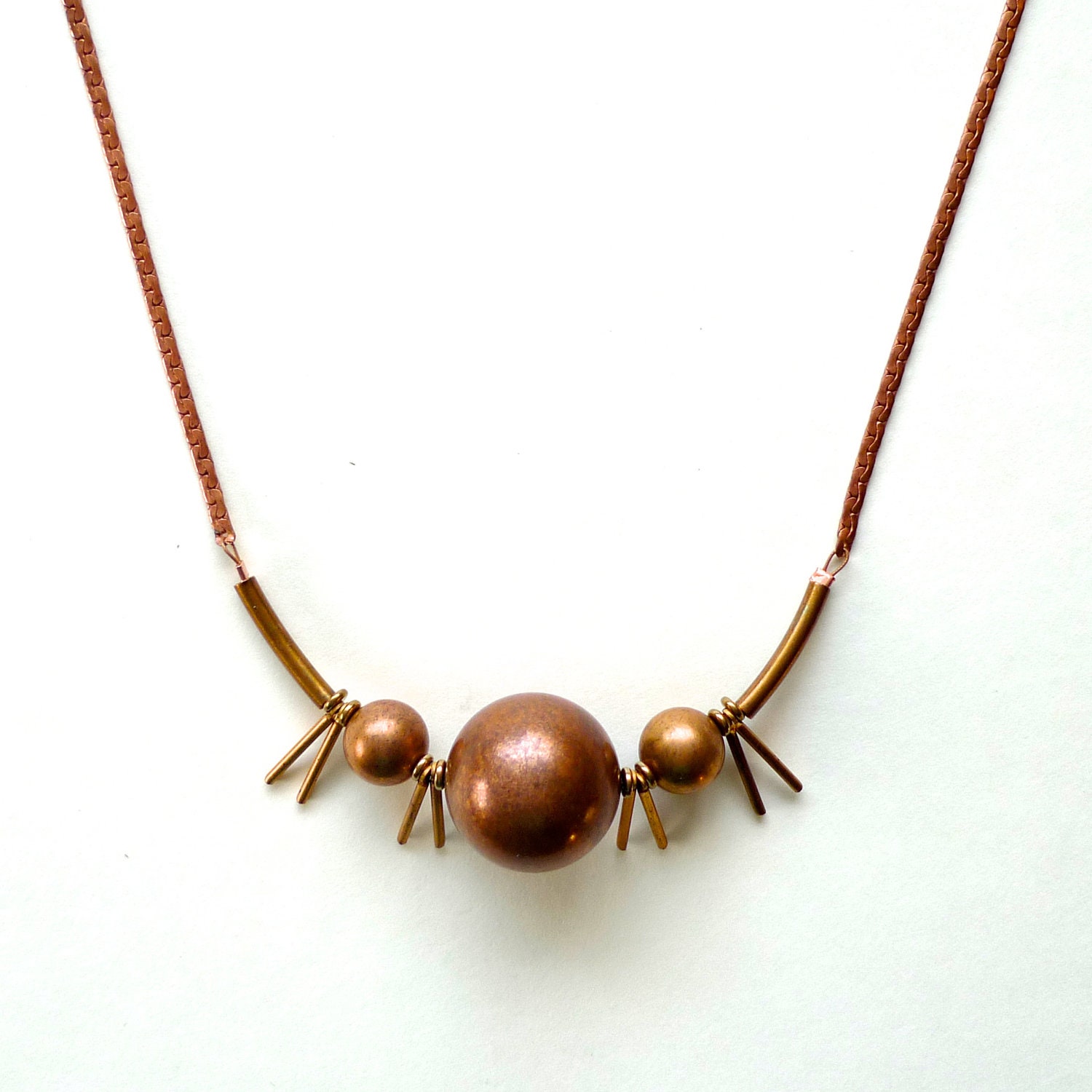 Large copper spheres and brass spikes necklace