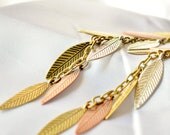 Long dangly falling leaf earrings in shades of metal