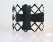 Sideways Black Metal Cross on a Diamond Embossed Leather Cuff