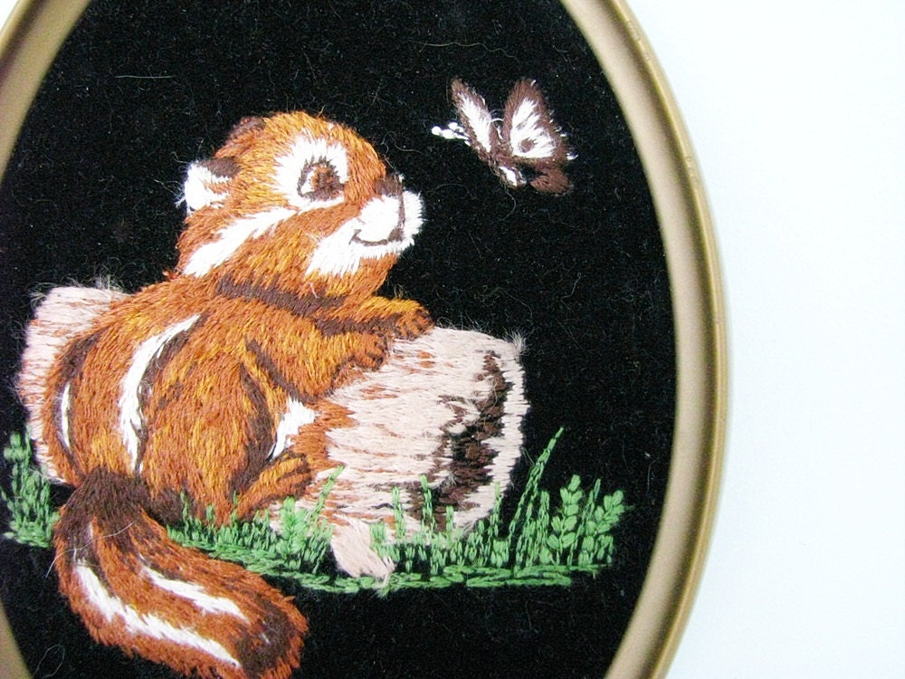 vintage Needlepoint Chipmunk in Oval Frame - sitting on a log visiting a butterfly