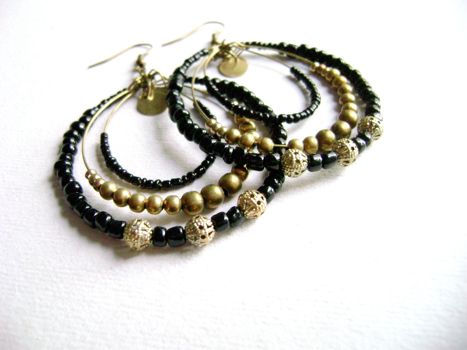 Sophistic - intense black and golden antique bronze long big earrings
