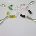Set of 4 beaded Wine Bottle Charms in pink, maroon, yellow and green