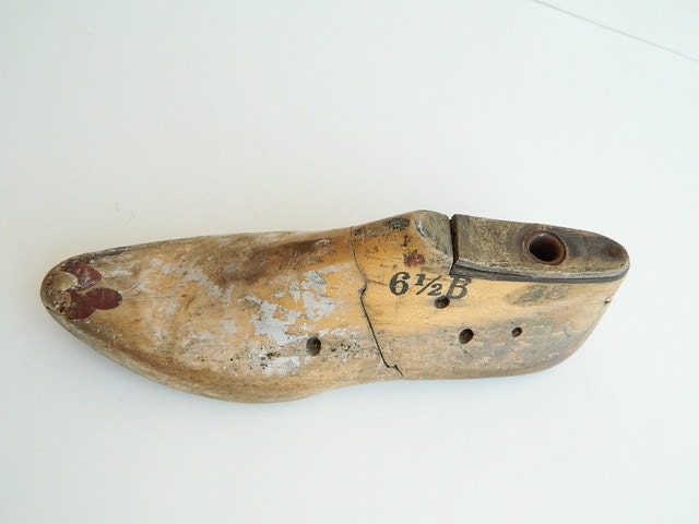 One industrial rustic wood shoe form