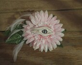 Grichels hair flower fascinator - pale pink and white chrysanthemum, white leather with green and white slit pupil eye