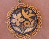 Toledo gold pendant and filligree with assorted chain