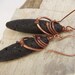 Long Oval Lava Earrings With a Copper Wrap