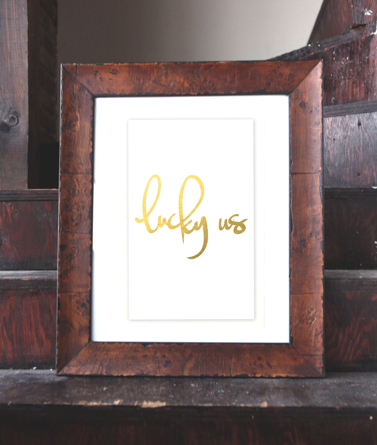 gilded poster: "lucky us"