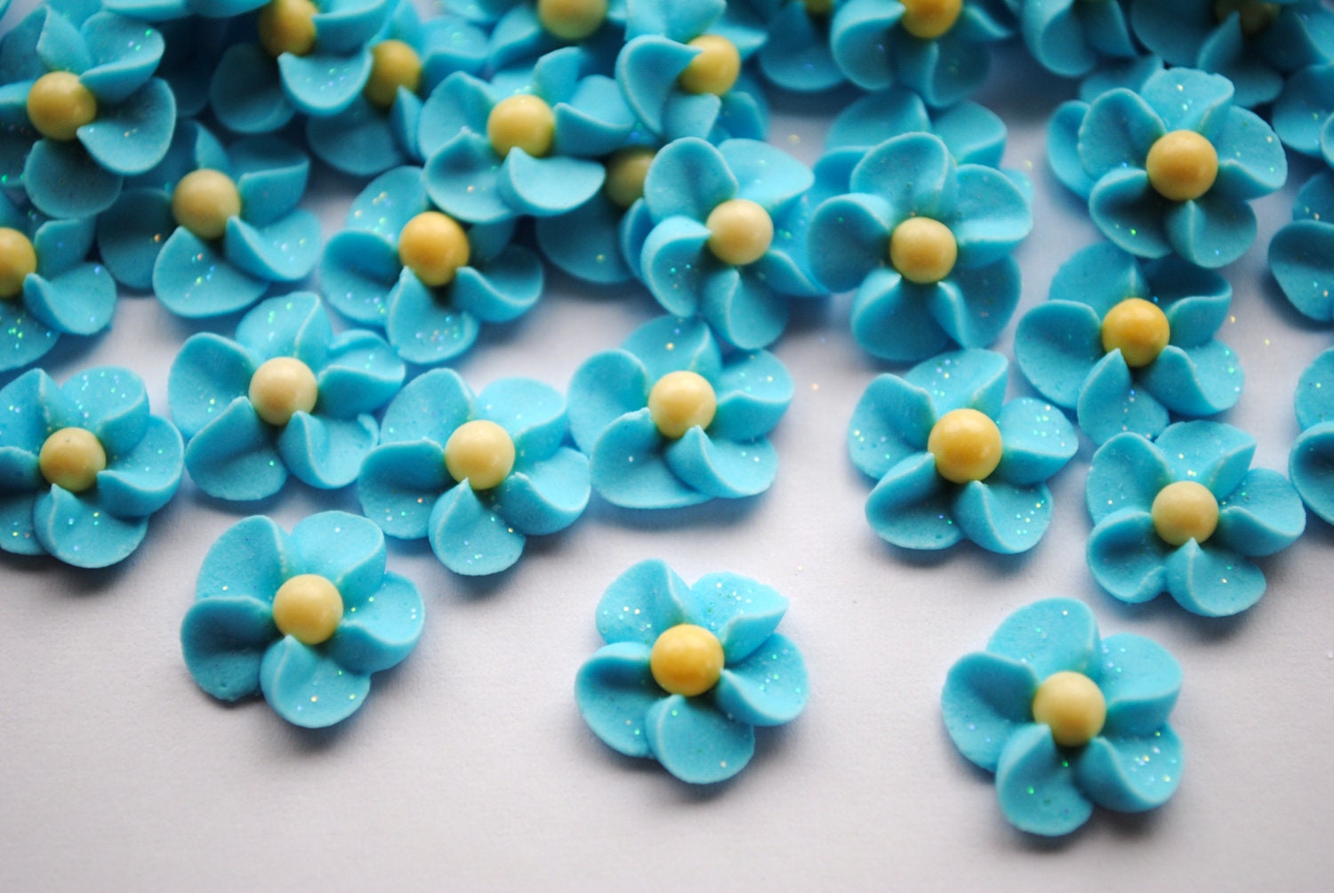 Forget Me Nots- Royal Icing Flowers LIght Blue with Yellow Matte Sugar Pearl Center and Sparkles (100)