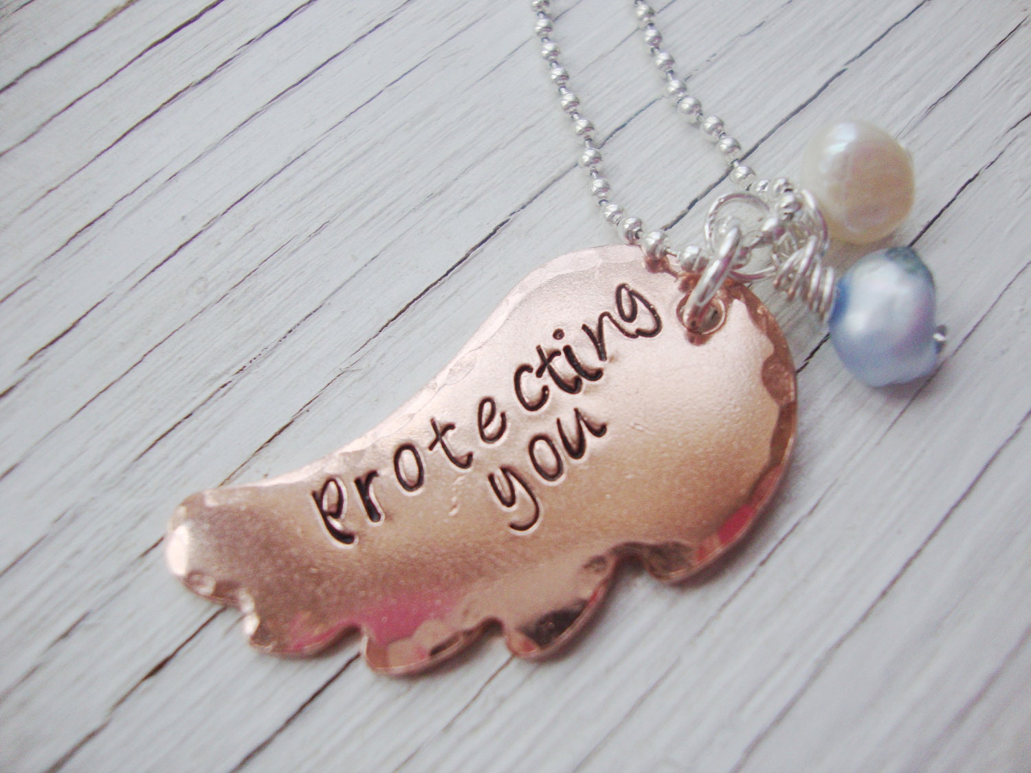 Protecting you hand stamped copper angel wing necklace with freshwater pearls