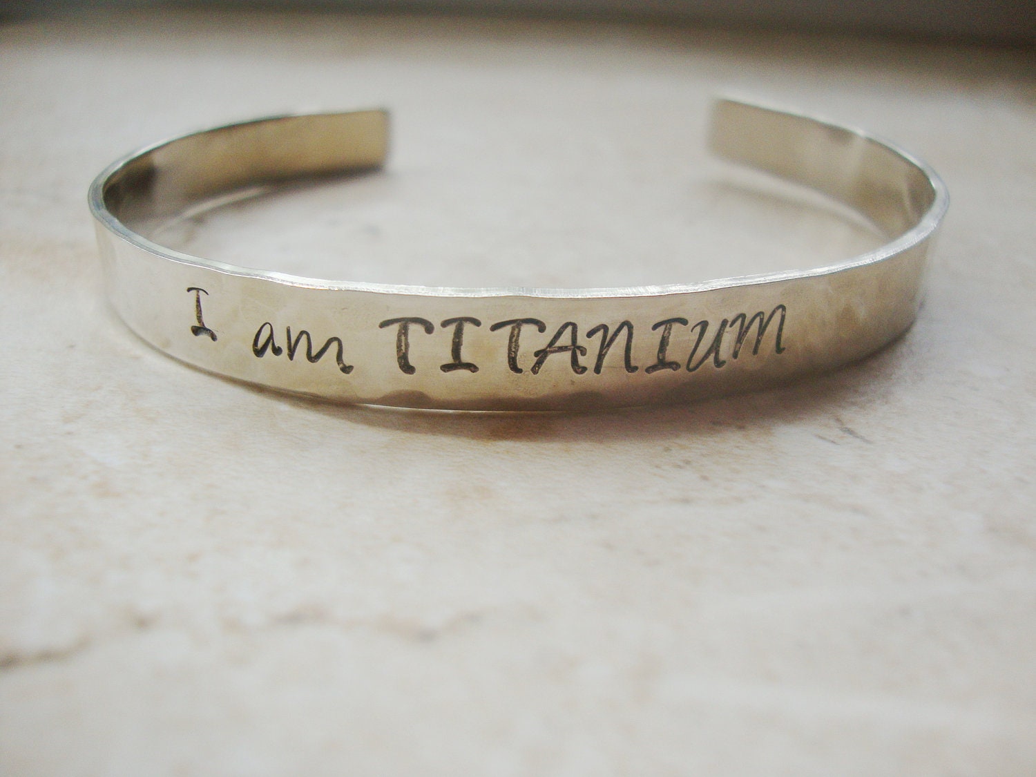 I am Titanium strength silver hammered hand stamped cuff bracelet