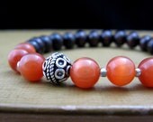 Chakra Energy Bracelet - Second Chakra - Orange Cat's Eye, Silver Bali Bead & Dark Brown Wood - by We Are 1