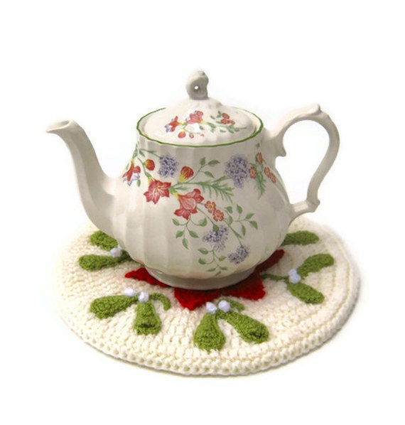 Crochet teapot stand coaster hot pad Christmas mistletoe and poinsettia traditional doily mat in festive red and green