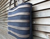 Wool tote bag with waxed leather handles, straps, and a waxed leather bottem