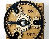 Black and Tan Planetary Gear Light Switch Plate