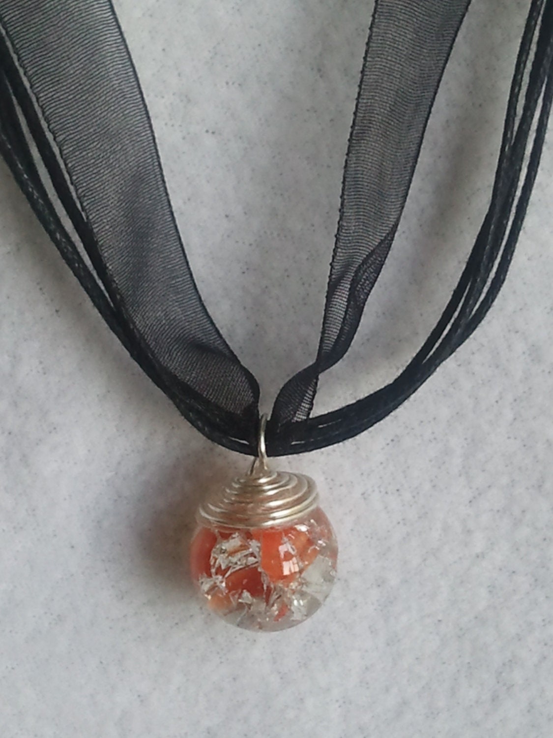 Fried Glass orange swirl  Marble on a black ribbon Necklace