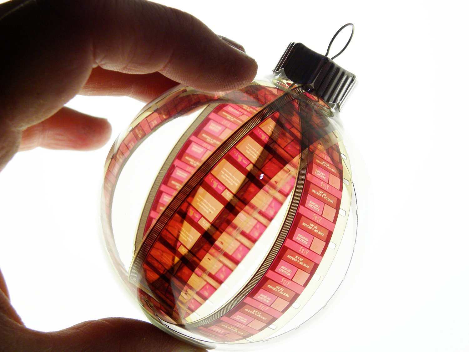 holiday ornament . glass bulb with vintage 16mm biology educational filmstrip . OOAK . great gift for photographers and filmmakers