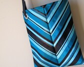 mini strappy (cross body) bag ----  black vinyl with ribbons of blue, teal and aqua