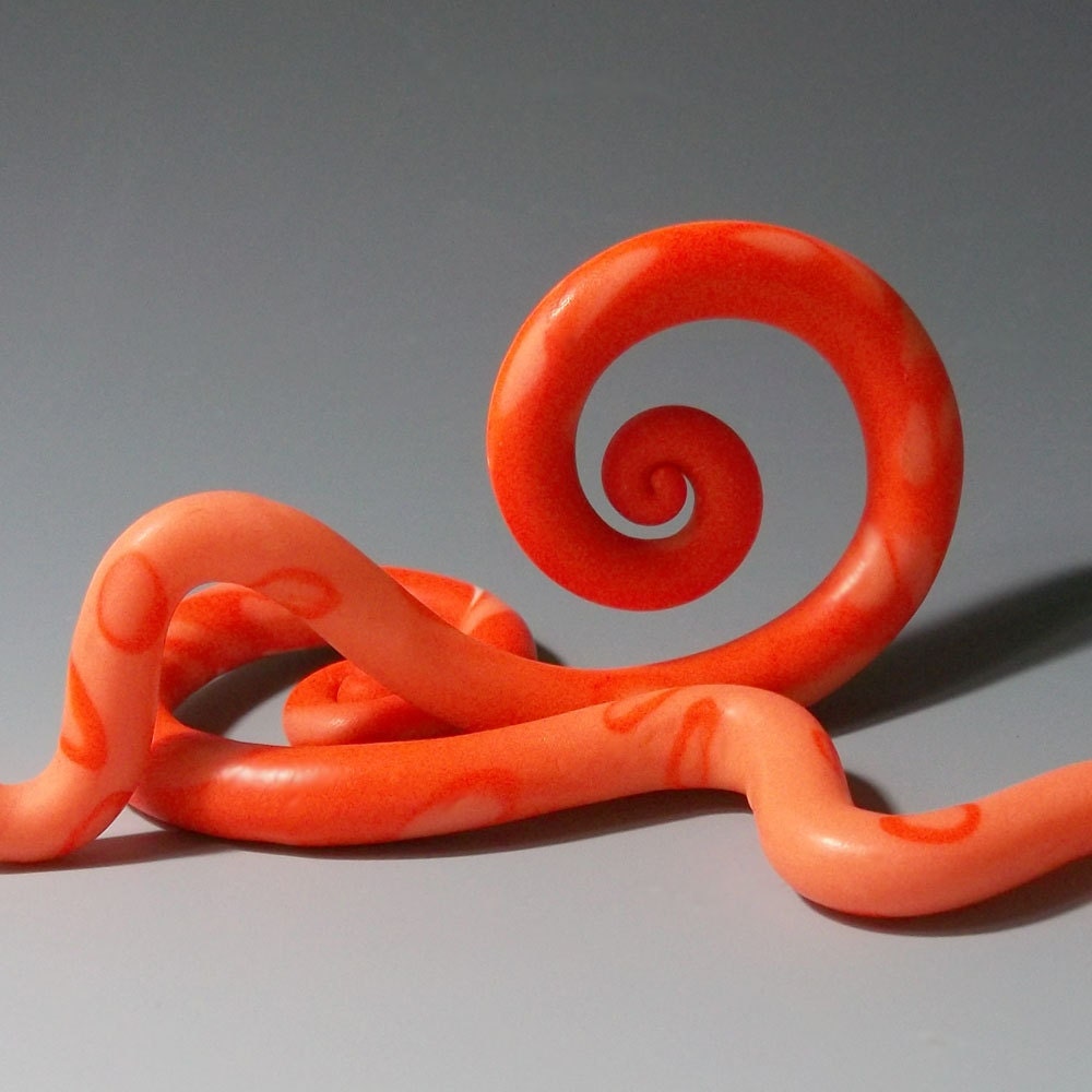 Gauged earrings, 00g, glow-in-the-dark,Cleopatra Mango. Polymer clay, spiral dangle plugs for stretched ears, orange.
