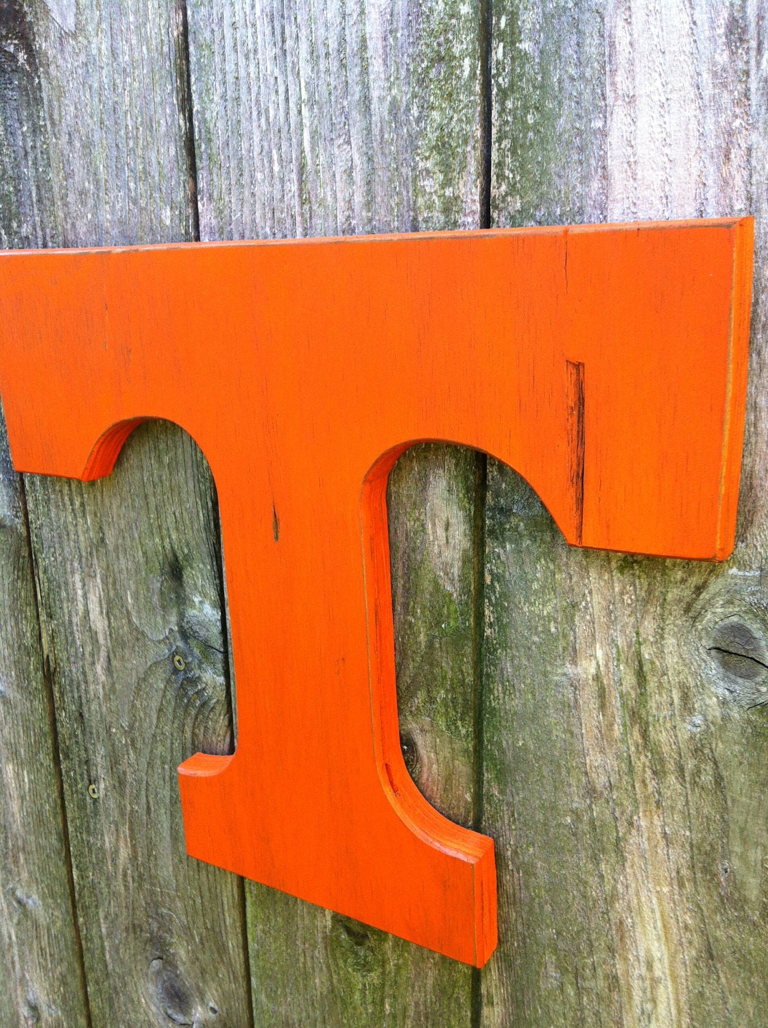 Wooden Tennessee Volunteers Orange T. Large distressed letter. University emblem