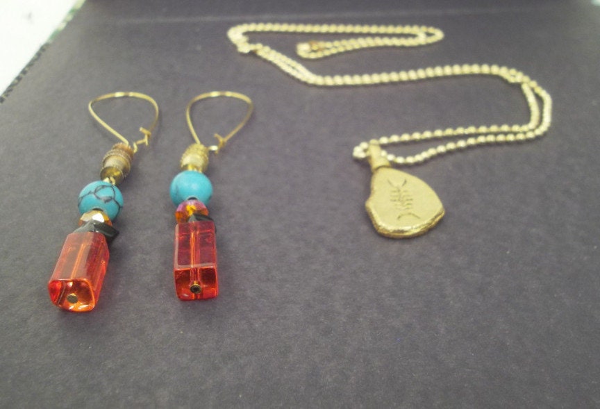 Golden fish bone "fossil" slab, golden ball chain necklace, earrings in tangerine glass and crystal, turquoise howlite:Golden Bone