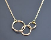 Modern swirl triple ring gold necklace