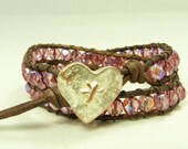 Perfect for Valentine's Day.  Beaded leather wrap bracelet, double wrap  in gorgeous rose and copper with copper heart closure, double wrap.