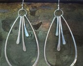 Hammered sterling silver organic teardrop hoop earrings with hammered silver "paddles". Medium sized women's earrings.