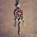 leone. a graceful dreamcatcher necklace.