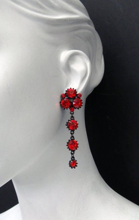 Cluster earring as seen on Tara from True Blood. Plated in black pearl, hypoallergenic, and handmade with light siam Swarovski crystals.