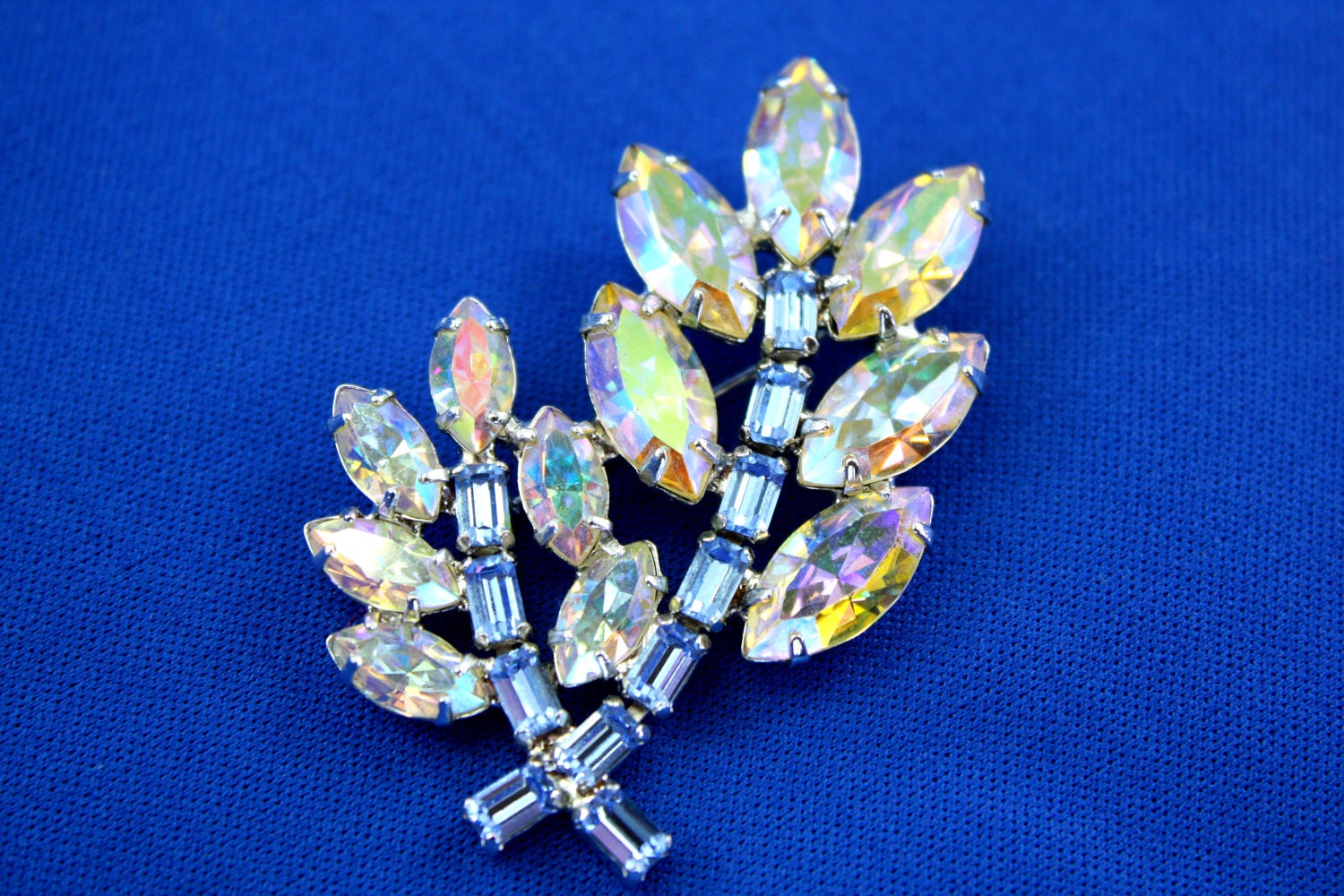 Vintage AB Rhinestone Brooch. Signed B David, Highly Colorful Irredescent Aurora Borealis and Baby Blue Rhinestones.