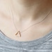 Brass triangle necklace: modern geometric jewelry