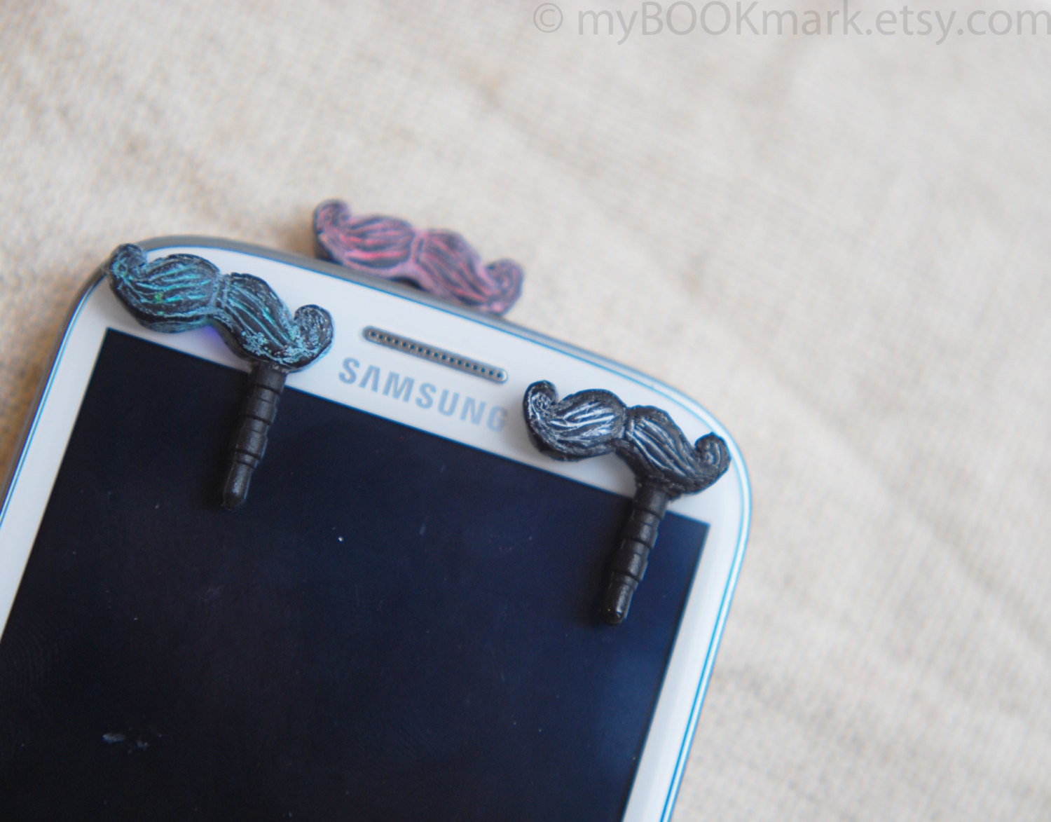 Mustache phone accessory. Set of 3. Movember dustplugs for earphone jack. iPhone 5 4 4s ,iPad ,Samsung galaxy s2 s3, 3.5mm output.  for all