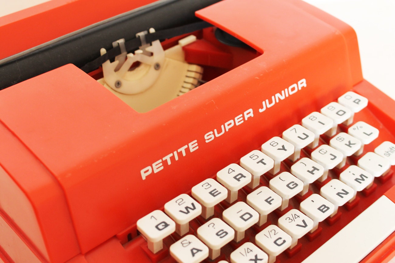 Vintage red typewriter by Byron Jardine Limited