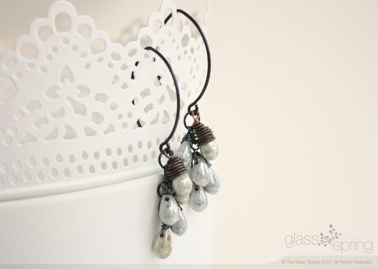 Earrings wire wrapped with antique brass wire with blue czech glass picasso drop beads.