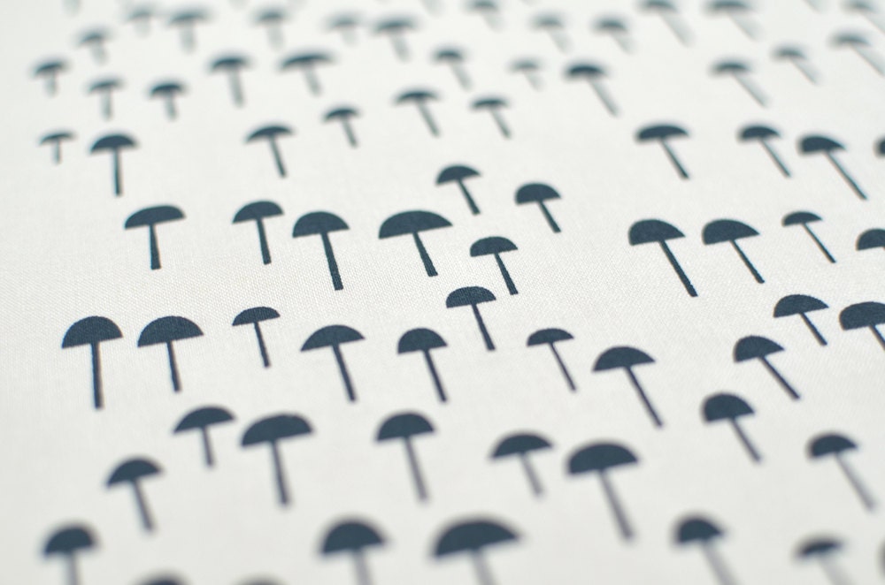 tiny forest in storm on bone quilting cotton handprinted fabric panel french navy blue