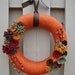 Burnt orange yarn wrapped wreath sage green, maroon, brown and gold