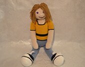 Crocheted Amigurumi Doll With Gold Shirt
