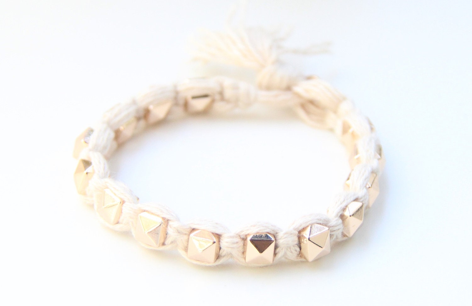 Arm candy - Gold pyramid beads and White cord - woven bracelet