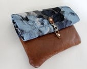 Fold over clutch, blue floral fabric and leather.