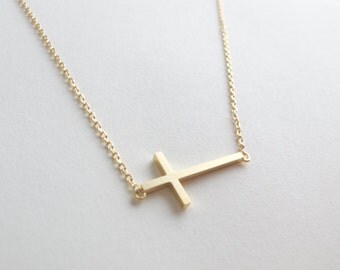 sideways cross necklace in gold