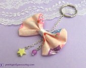 Kawaii Pink Pastel Cupcake Print Fabric Bow Keychain / Bag Charm with Plastic Star and Glass Sphere Bead