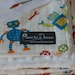 Organic Baby Blanket with Stroller Ties, Robot Factory in Multi by Caleb Gray and White Dot Minky