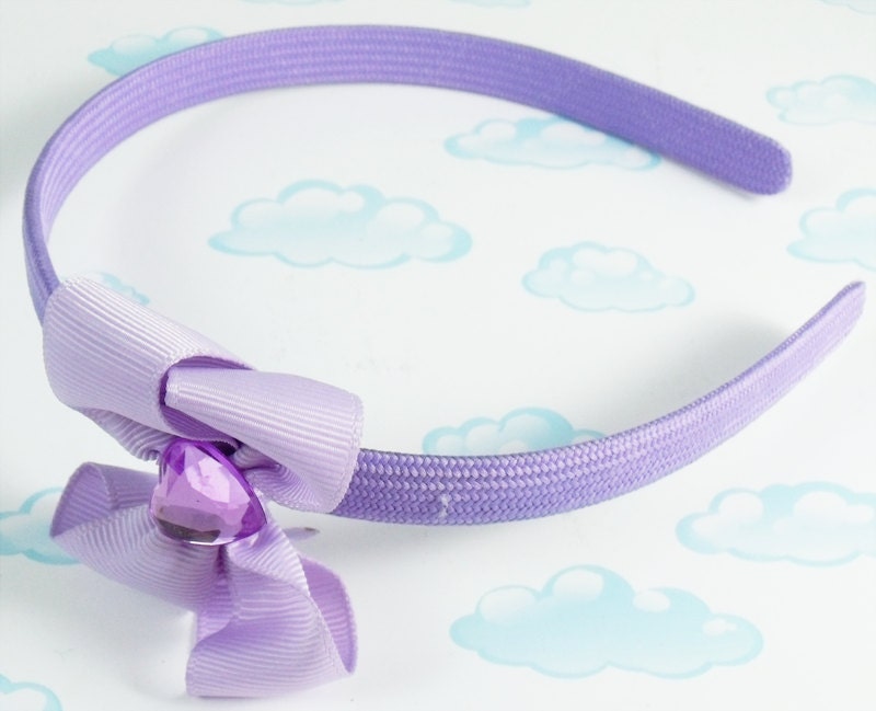 Lavender bow on purple headband with purple rhinestone center