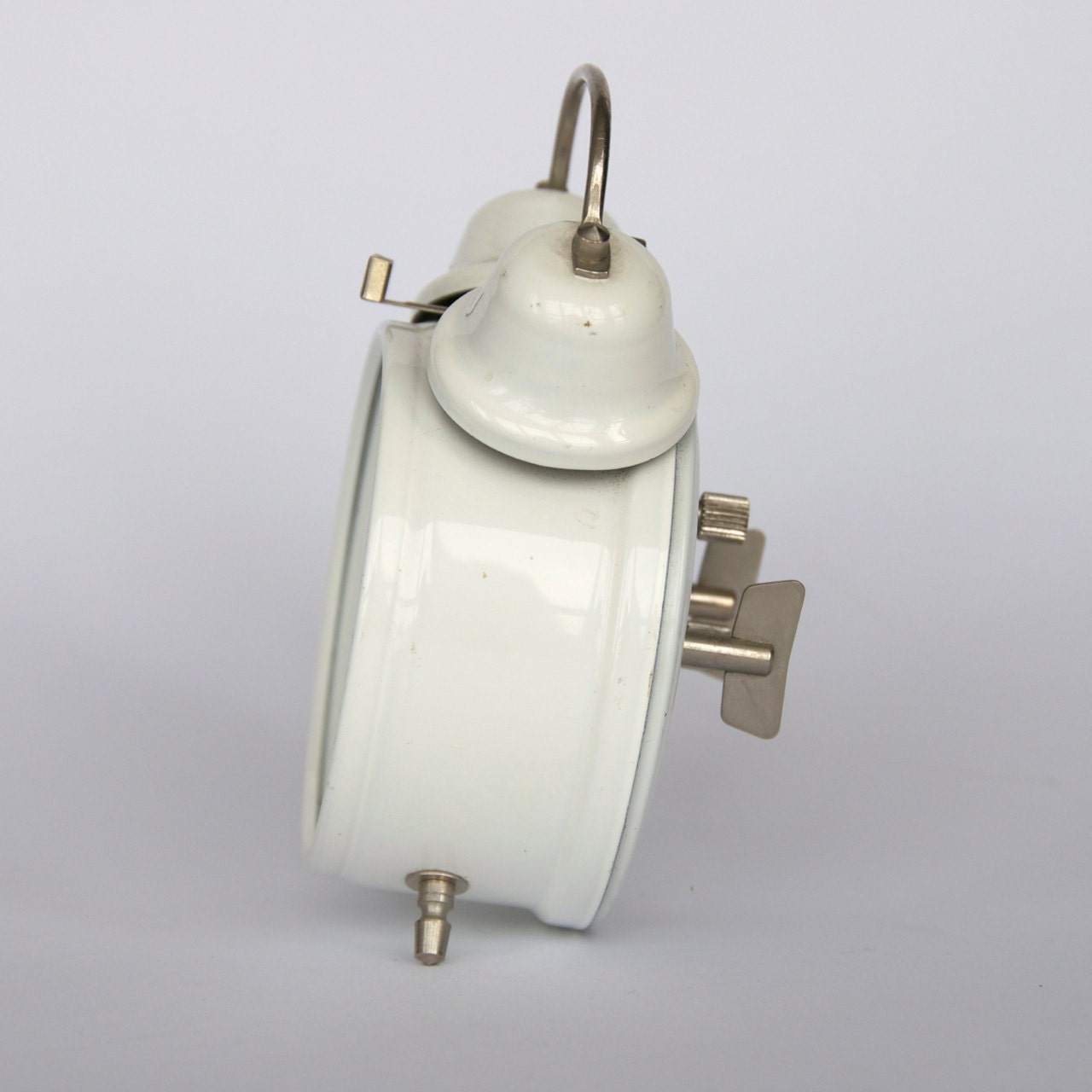Vintage Czech small mechanical alarm clock from Prim. Dual bell. White.