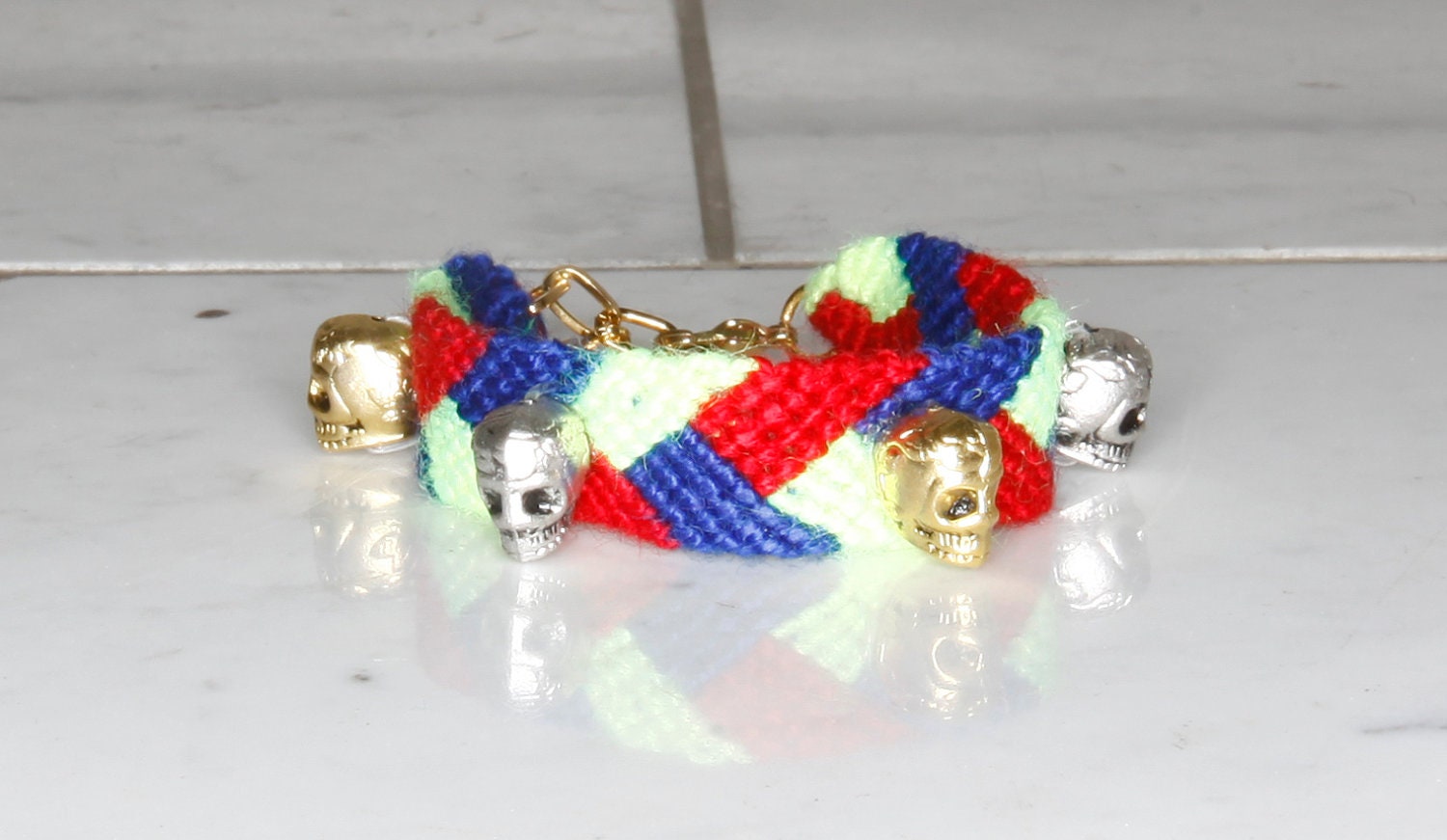 silver and golden skull friendship bracelet. friday the 13th