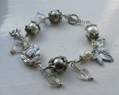 Stunning toggle clasp glitz and glam pearl and charm Bracelet great Christmas gift idea.