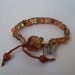 Chez glass and silk cord wrapped bracelet