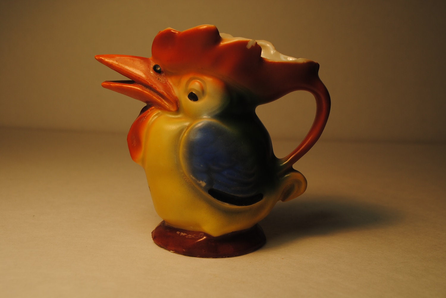 antique 1930s IRISH creamer TOUCAN which is associated with Guinness beer a lovley and rare find blue orange yellow